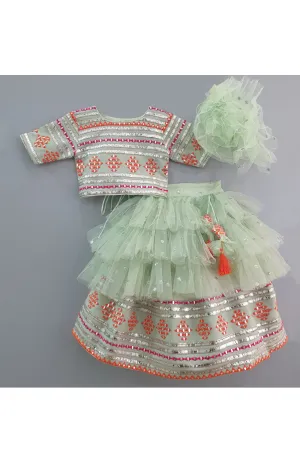 Sea green embroidered choli and lehenga with frilly dupatta