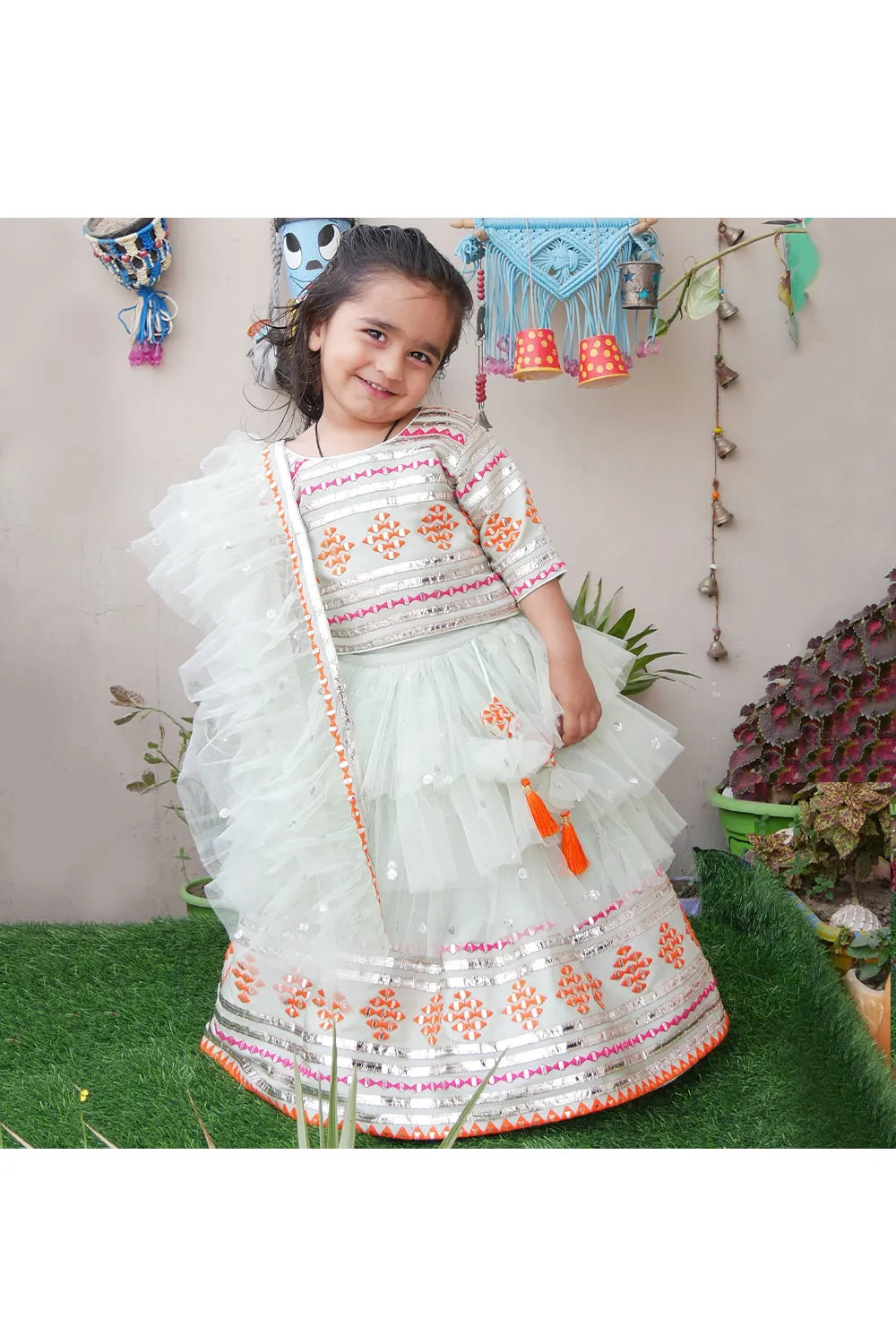 Sea green embroidered choli and lehenga with frilly dupatta