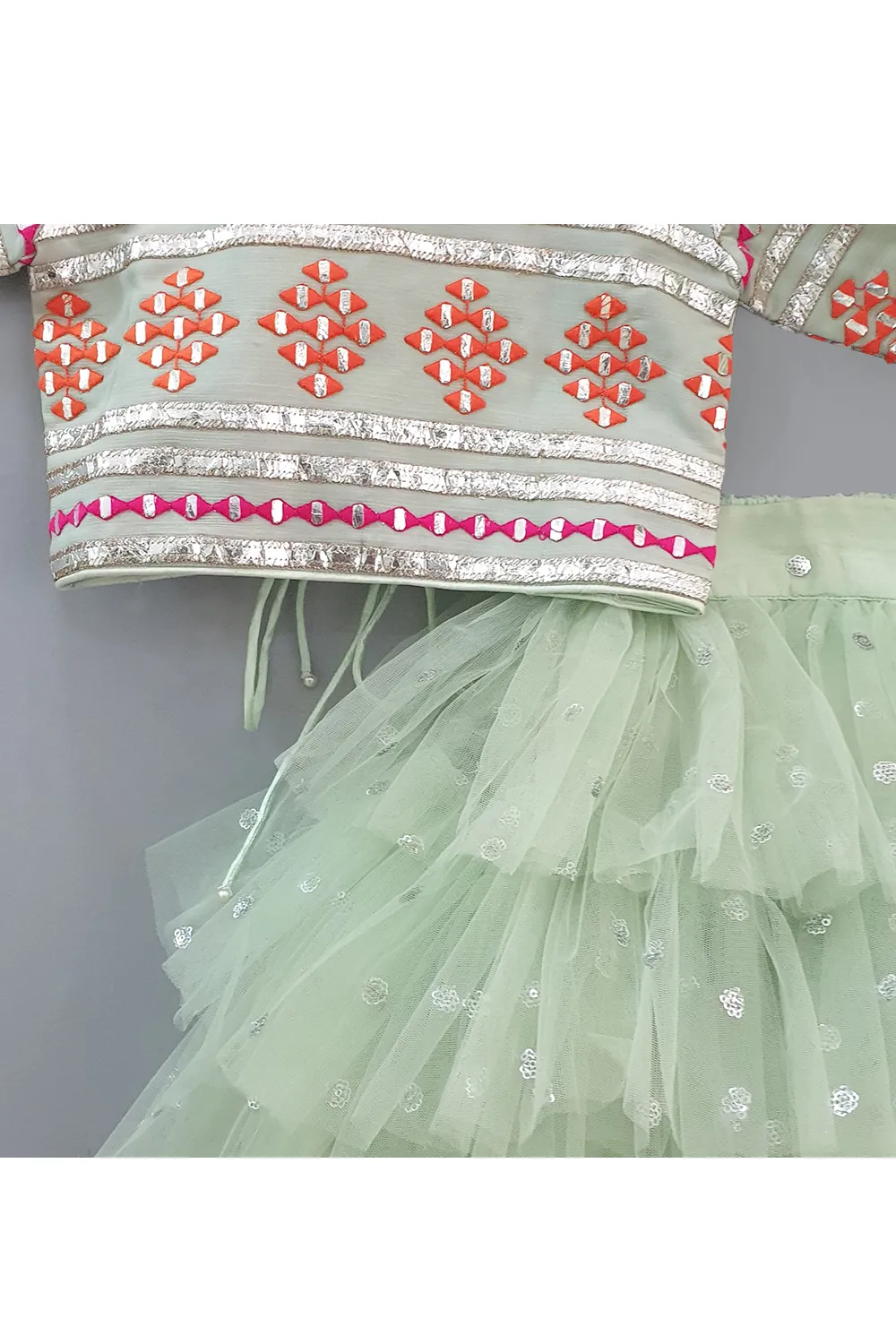 Sea green embroidered choli and lehenga with frilly dupatta